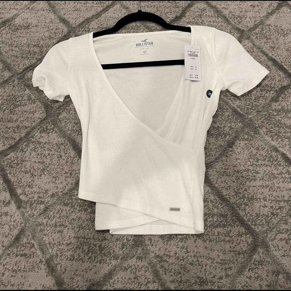 Brand new hollister white cross over top.